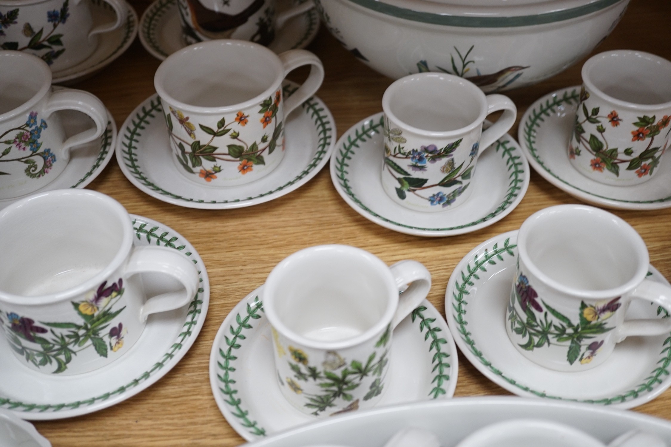 A mixed Portmerion dinner service- a biscuit jar and cover, tureens, serving dishes, teapot etc